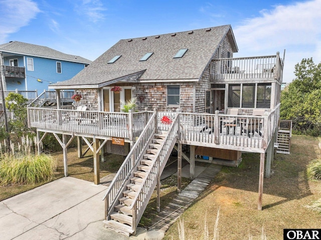 26239 Rampart St Lot 13, Salvo, NC 27972 - back of property featuring a shingled roof and stairway