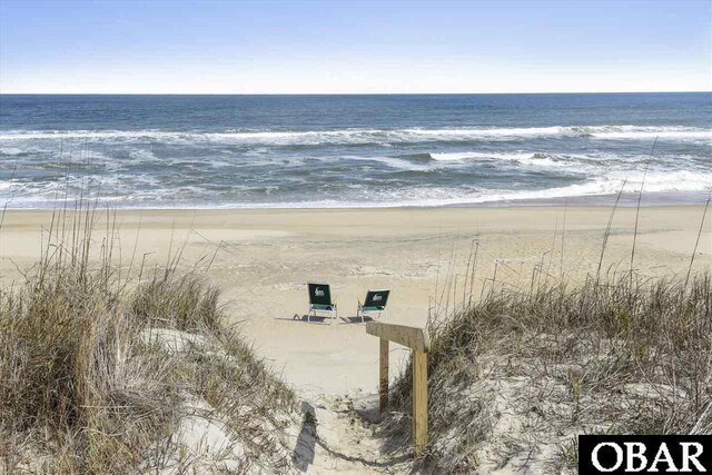 property view of water featuring a beach view