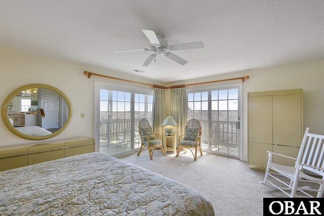 carpeted bedroom featuring a ceiling fan, access to outside, and multiple windows
