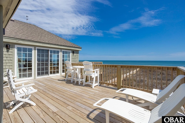 wooden deck with a water view