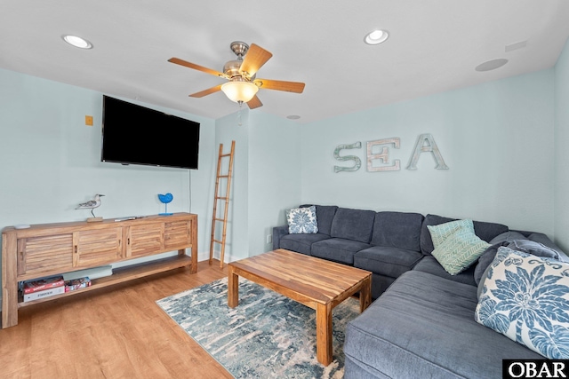 living area featuring ceiling fan, wood finished floors, and recessed lighting