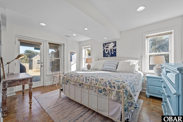 bedroom with access to exterior, multiple windows, baseboards, and recessed lighting