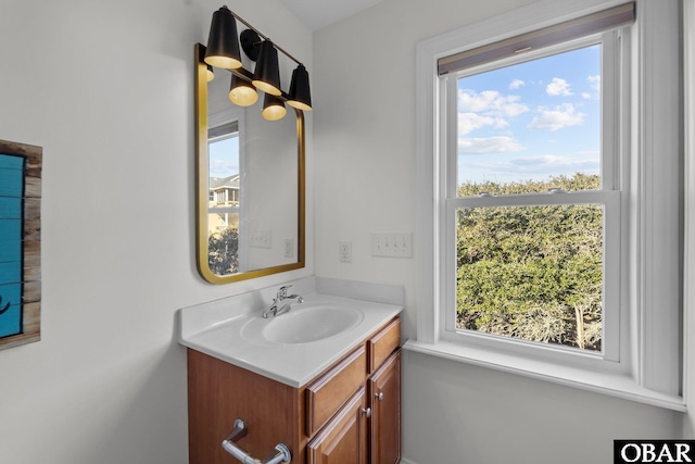 bathroom with a wealth of natural light and vanity