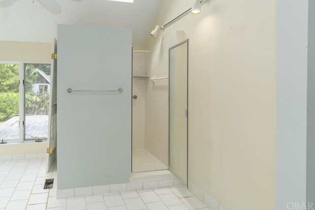 bathroom featuring tiled shower and tile patterned floors
