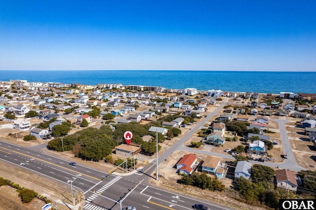 aerial view featuring a water view and a residential view