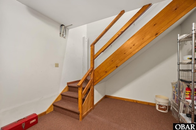 stairs featuring carpet floors and baseboards