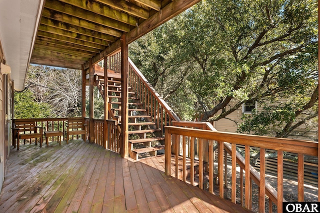 wooden terrace featuring stairs