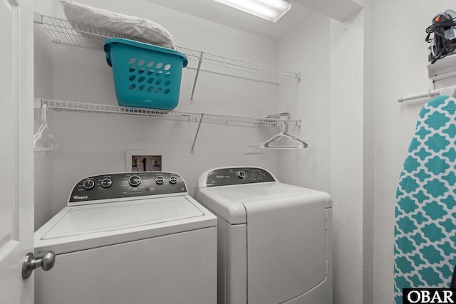 laundry area featuring washing machine and clothes dryer