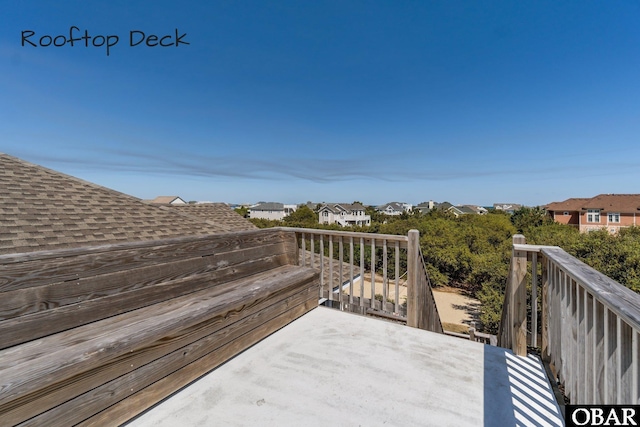 wooden deck featuring a residential view