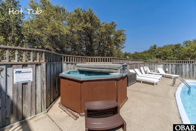 view of patio with a hot tub