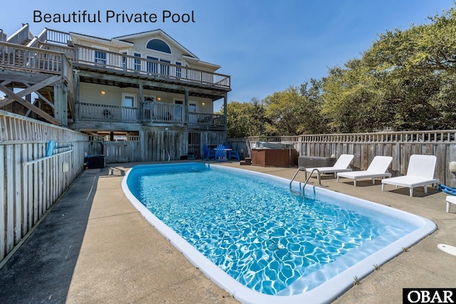 view of pool with a fenced backyard, a fenced in pool, and a patio