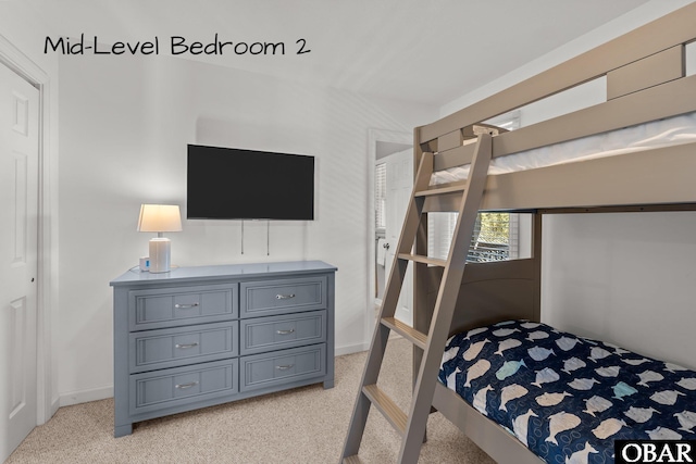 bedroom featuring light carpet