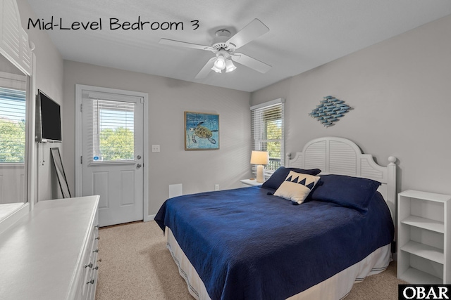 bedroom featuring light carpet and ceiling fan