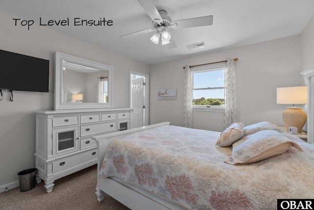 bedroom with dark colored carpet, visible vents, baseboards, and a ceiling fan