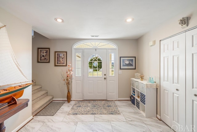 foyer with baseboards, visible vents, marble finish floor, stairs, and recessed lighting