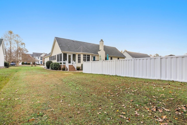 110 Brumsey Landing Dr Lot # 24, Moyock, NC 27958 - back of house with a lawn, fence, a sunroom, and a chimney