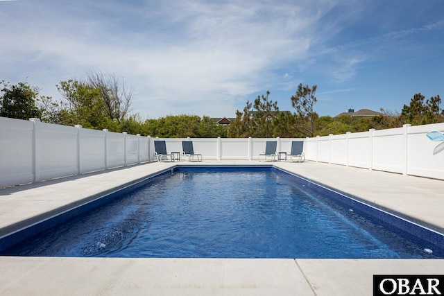 view of swimming pool with a patio, a fenced backyard, and a fenced in pool