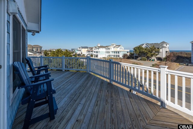 wooden deck with a residential view