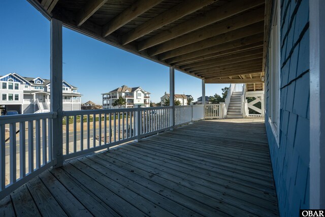 wooden terrace with a residential view