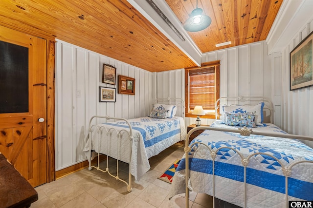 bedroom featuring light tile patterned floors and wood ceiling