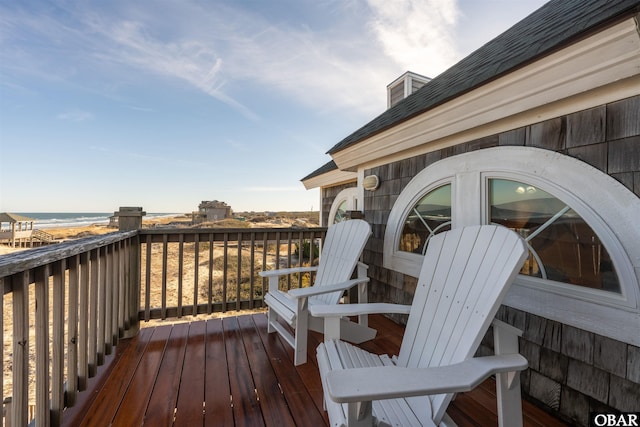 wooden deck with a water view