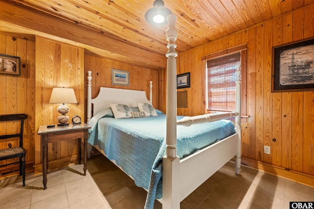 bedroom with wood ceiling, wooden walls, and light tile patterned flooring