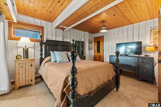 bedroom featuring light tile patterned flooring and wooden ceiling