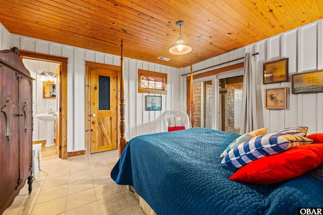 bedroom featuring light tile patterned floors, wooden ceiling, and visible vents