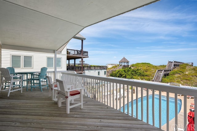 deck with an outdoor pool