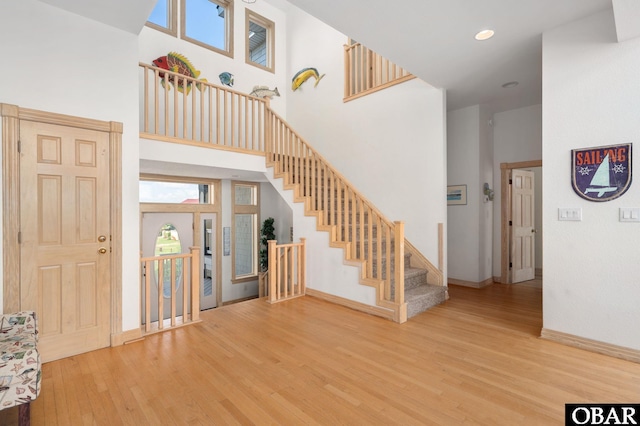 385 Deep Neck Rd Lot # 131, Corolla, NC 27927 - entryway with wood finished floors, stairway, and a towering ceiling