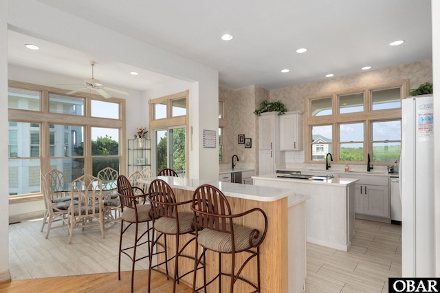 385 Deep Neck Rd Lot # 131, Corolla, NC 27927 - kitchen featuring a center island, recessed lighting, healthy amount of natural light, ceiling fan, and light countertops