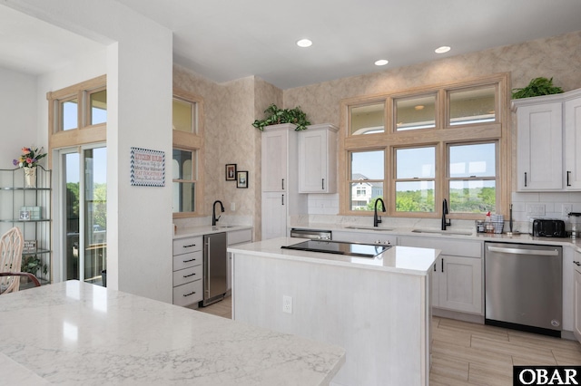 385 Deep Neck Rd Lot # 131, Corolla, NC 27927 - kitchen with dishwasher, a center island, recessed lighting, backsplash, and white cabinetry