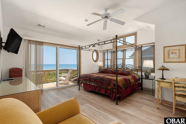 385 Deep Neck Rd Lot # 131, Corolla, NC 27927 - bedroom featuring access to outside, light wood-style floors, lofted ceiling, and a water view