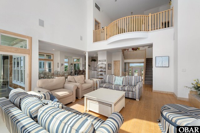385 Deep Neck Rd Lot # 131, Corolla, NC 27927 - living room with light wood-style flooring and a towering ceiling
