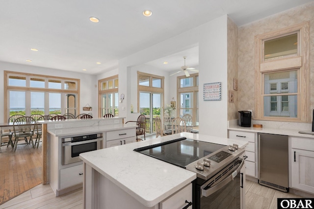 385 Deep Neck Rd Lot # 131, Corolla, NC 27927 - kitchen featuring stainless steel appliances, a center island, recessed lighting, ceiling fan, and white cabinets