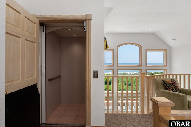 385 Deep Neck Rd Lot # 131, Corolla, NC 27927 - hall featuring high vaulted ceiling, elevator, and carpet flooring