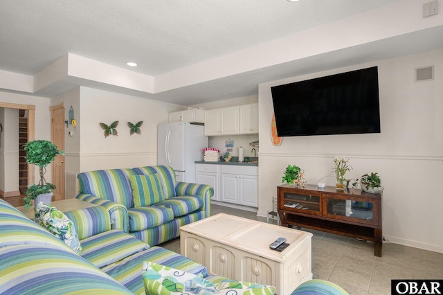 385 Deep Neck Rd Lot # 131, Corolla, NC 27927 - living room featuring light tile patterned floors and recessed lighting