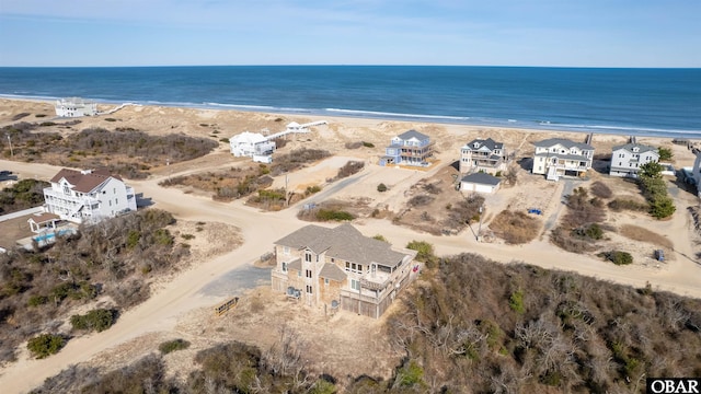 drone / aerial view with a view of the beach and a water view