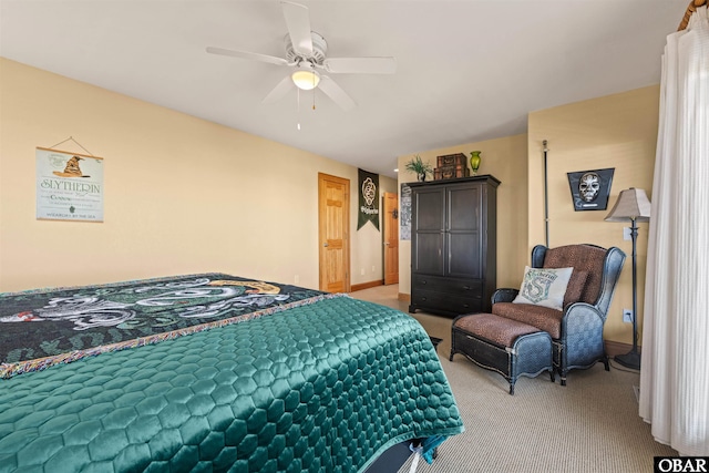 bedroom with baseboards, carpet floors, and ceiling fan