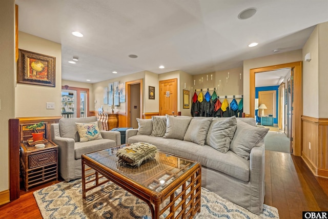 living room featuring wainscoting, wood finished floors, and recessed lighting