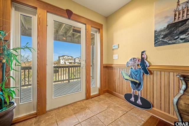 entryway featuring wainscoting