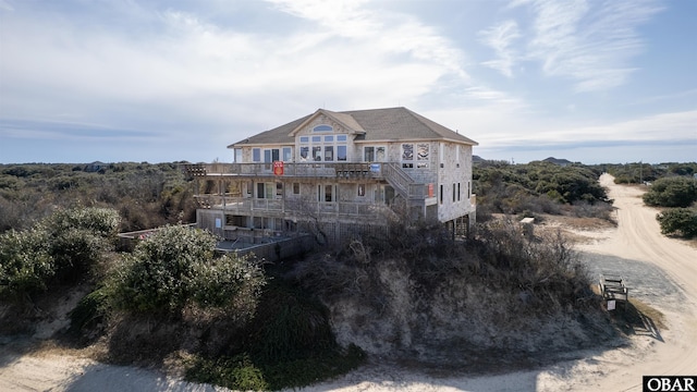 view of front of home featuring a wooden deck