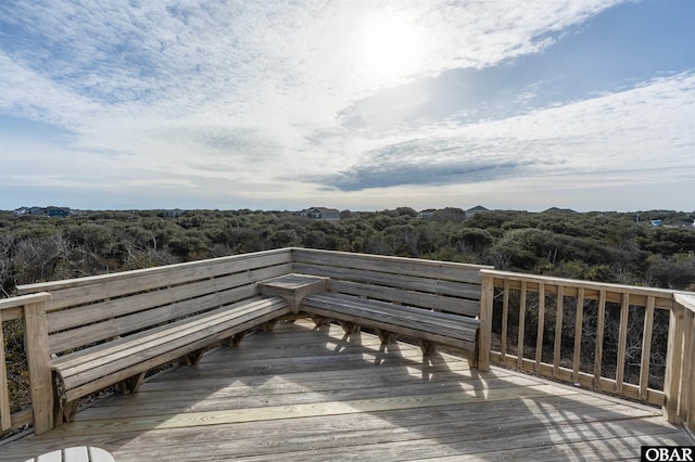 deck featuring a view of trees