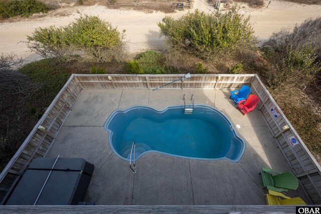 view of pool featuring a patio area and a fenced in pool