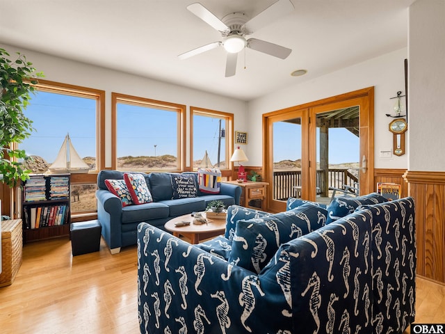 1672 Sandfiddler Rd Lot # 1 & 3, Corolla, NC 27927 - living room with a wainscoted wall, a ceiling fan, light wood-style flooring, and a wealth of natural light