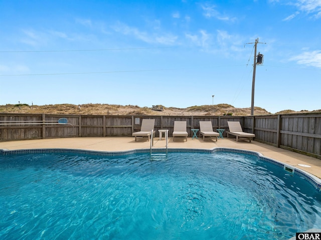 1672 Sandfiddler Rd Lot # 1 & 3, Corolla, NC 27927 - view of swimming pool featuring a fenced in pool, a patio area, and fence