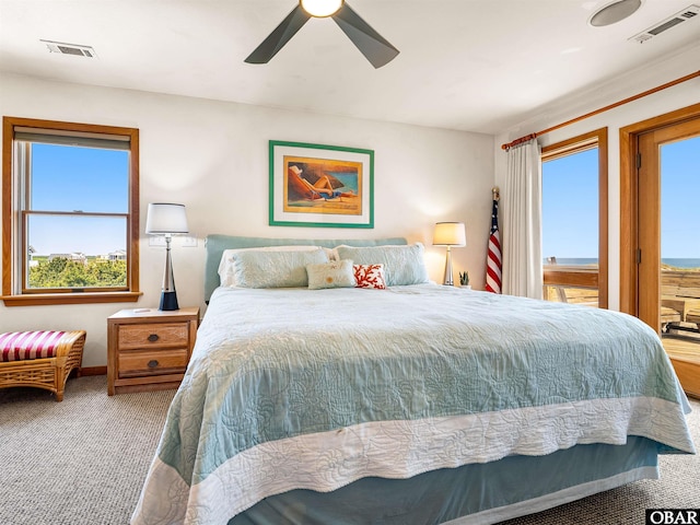 1672 Sandfiddler Rd Lot # 1 & 3, Corolla, NC 27927 - carpeted bedroom featuring multiple windows, a ceiling fan, and visible vents