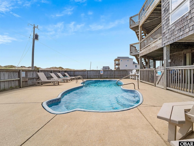 1672 Sandfiddler Rd Lot # 1 & 3, Corolla, NC 27927 - community pool with a fenced backyard, a patio area, and a deck