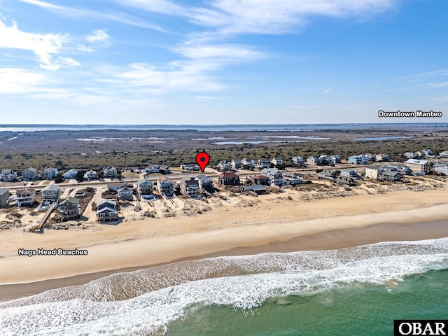 aerial view featuring a water view and a beach view