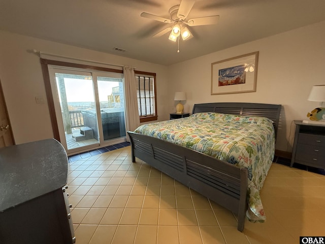 bedroom featuring light tile patterned floors, access to outside, visible vents, and a ceiling fan